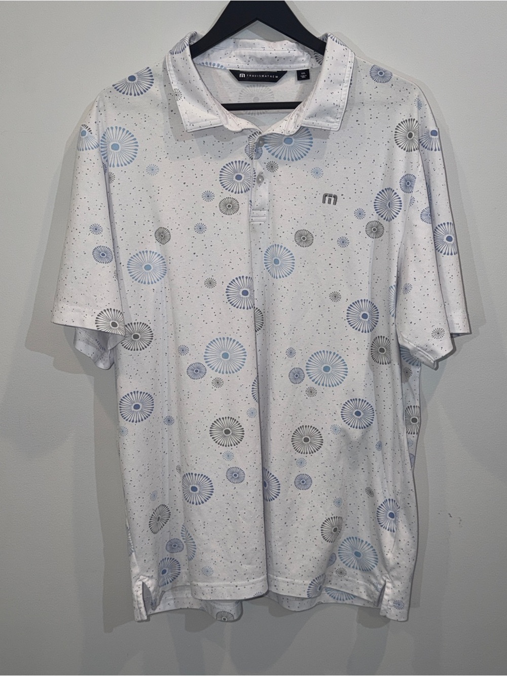 Travis Mathew White Polo with Blue and Gray Radial Print